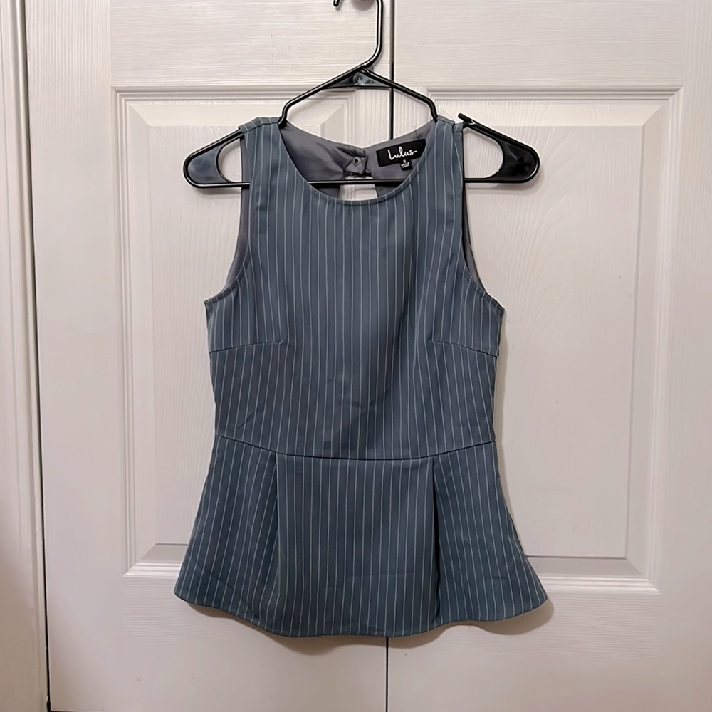 Blue greyish business casual top with cut out back.